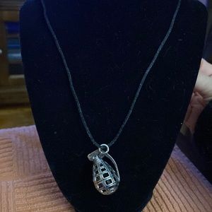 Grenade pendant on black rope necklace